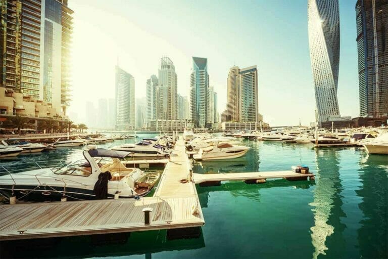 Dubai marina - luxury yachts and tall buildings in the background
