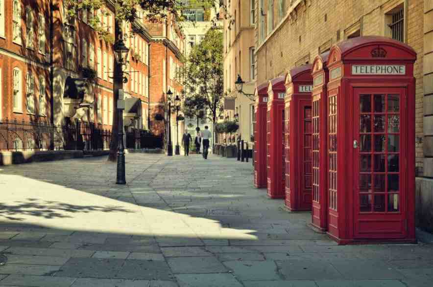 London street lined up with red phone boxes