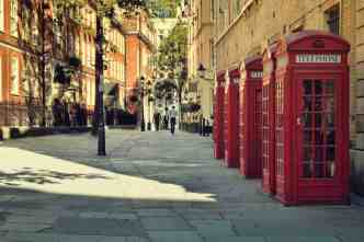 London street lined up with red phone boxes