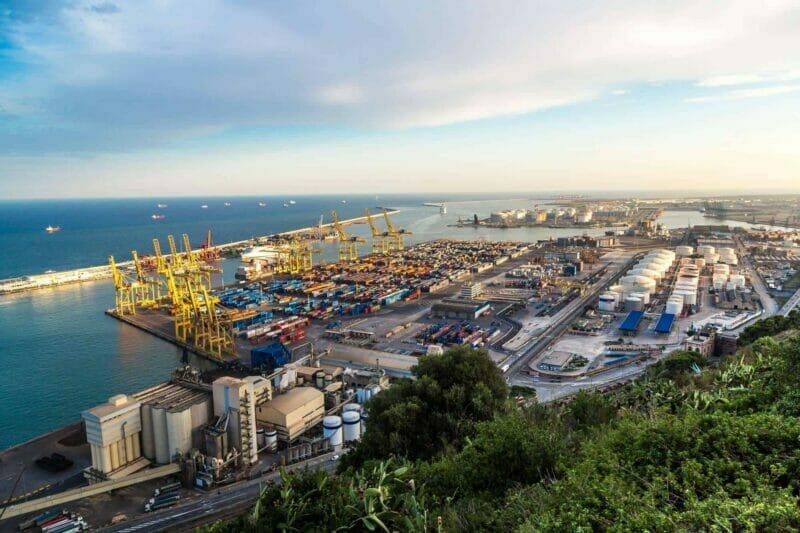 Panoramic view of the port in Barcelona: shipping containers and loading bays. Removals to Spain