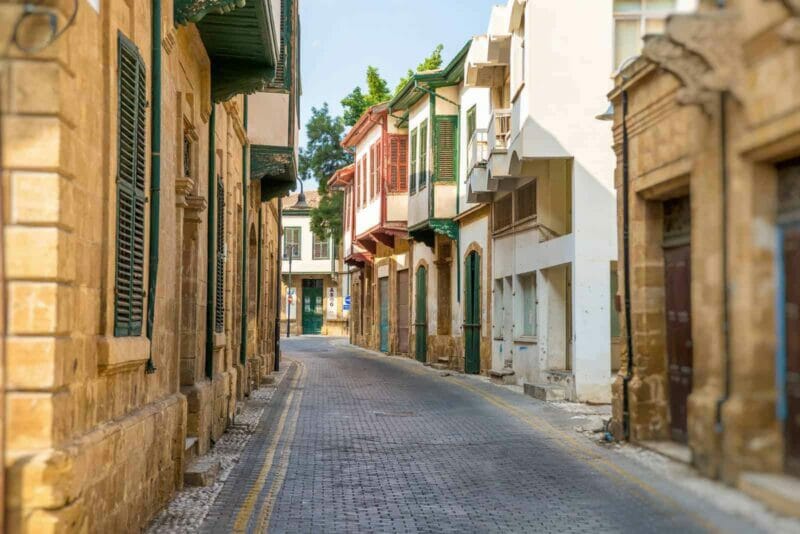 narrow historic street in central Nicosia lined with townhouses.