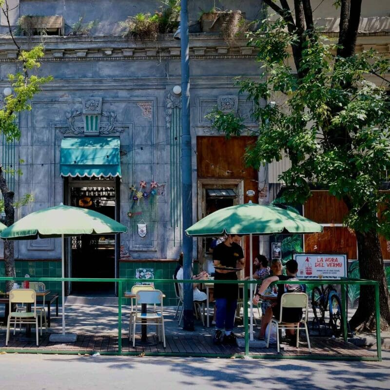 A street cafe in Palermo, Buenos Aires - people sitting outside drinking coffee, one of the best neighborhoods to live in Buenos Aires