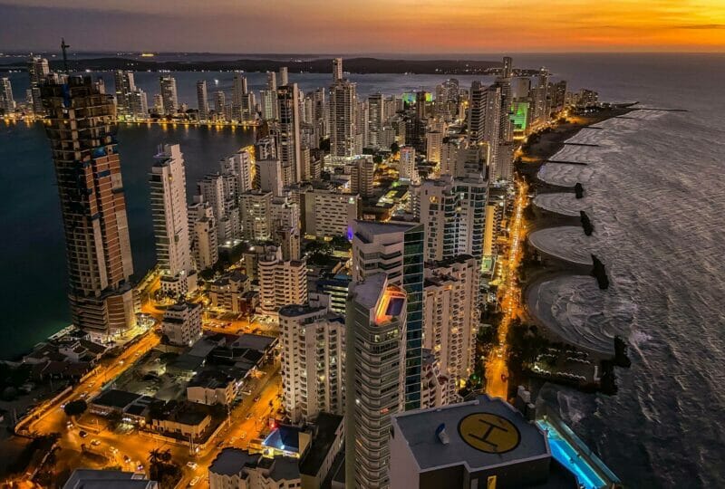 Bocagrande district in Cartagena Colombia at night - a brightly lit up cityscape by th sea
