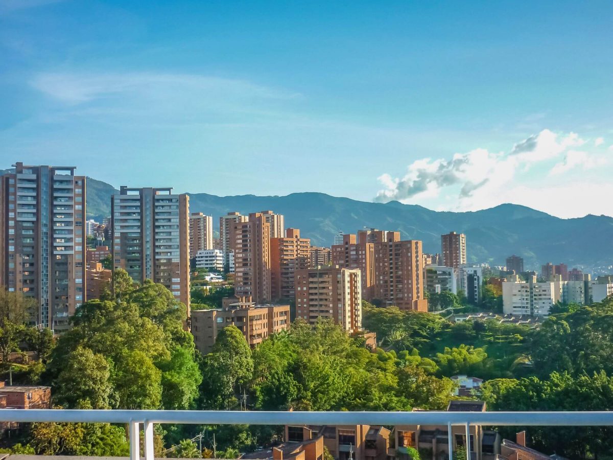 A city view from a balcony - Medellin's high apartment blocks with mountains in the background