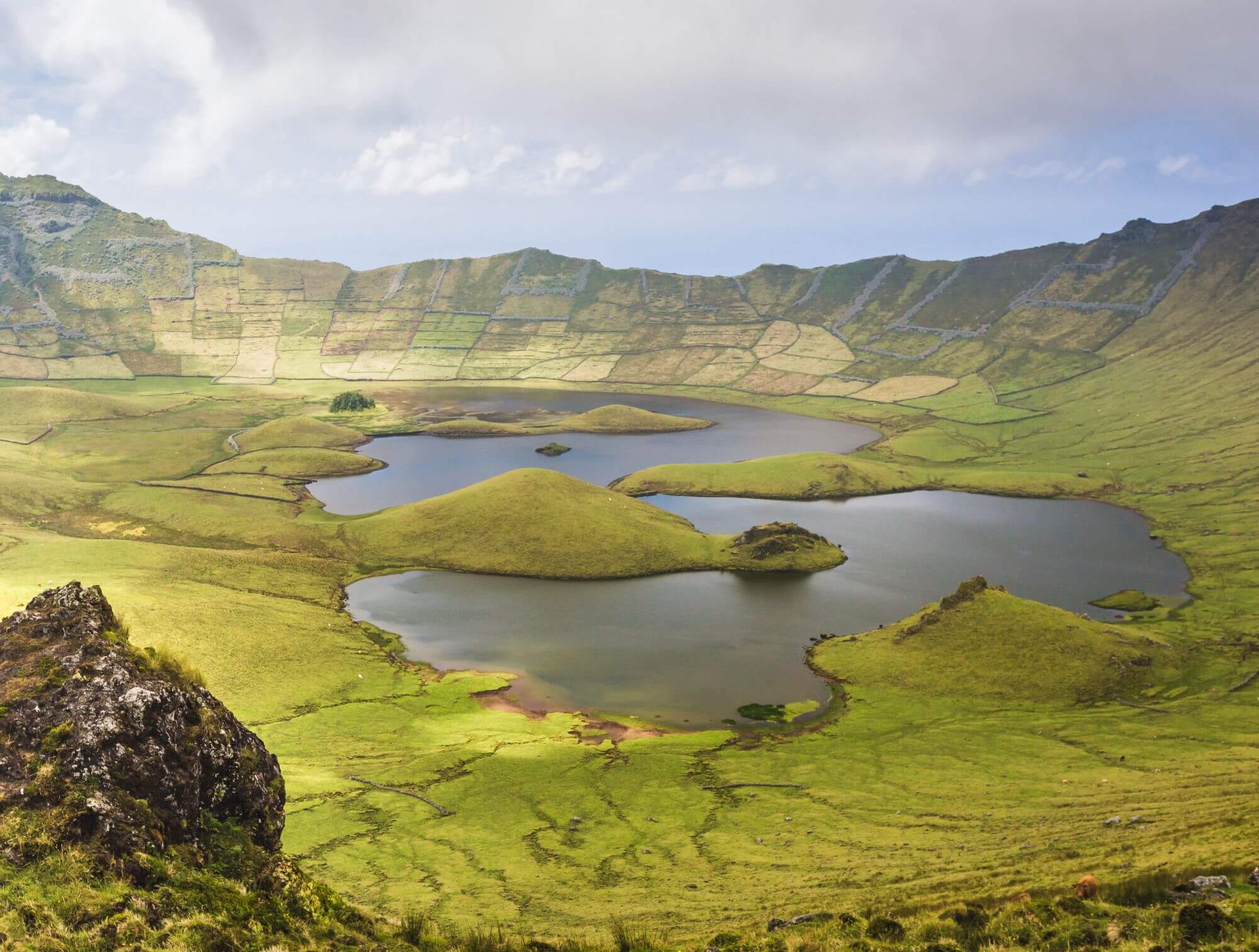 The volcanic crater (Caldeirao) with a beautiful lake on the top of Corvo island. Azores islands, Portugal
