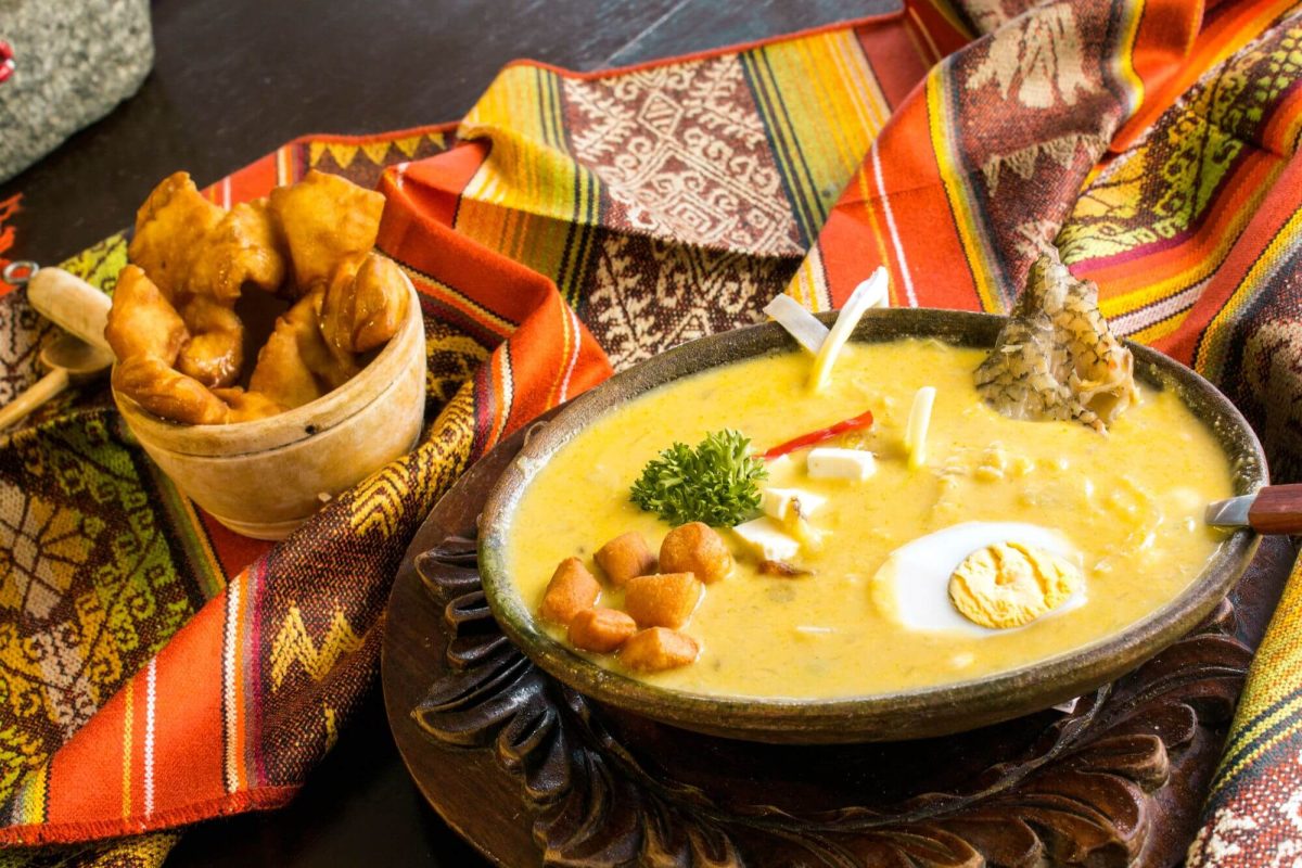 A rich and creamy soup served with bread and herbs - a traditional Easter soup in Ecuador, Fanesca
