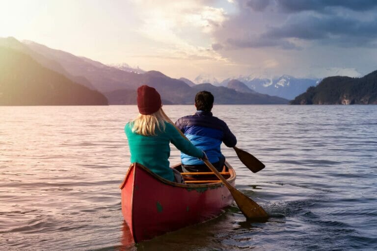 Two people kayaking on Harrison Lake in Canada.