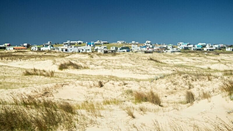 Houses on the sand dunes of the Cabo Polonio National Park in Uruguay