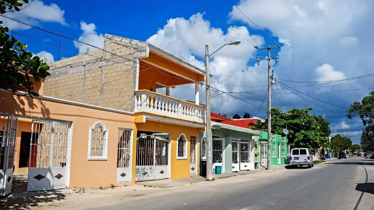 Old colorful buildings along the street in Tulum
