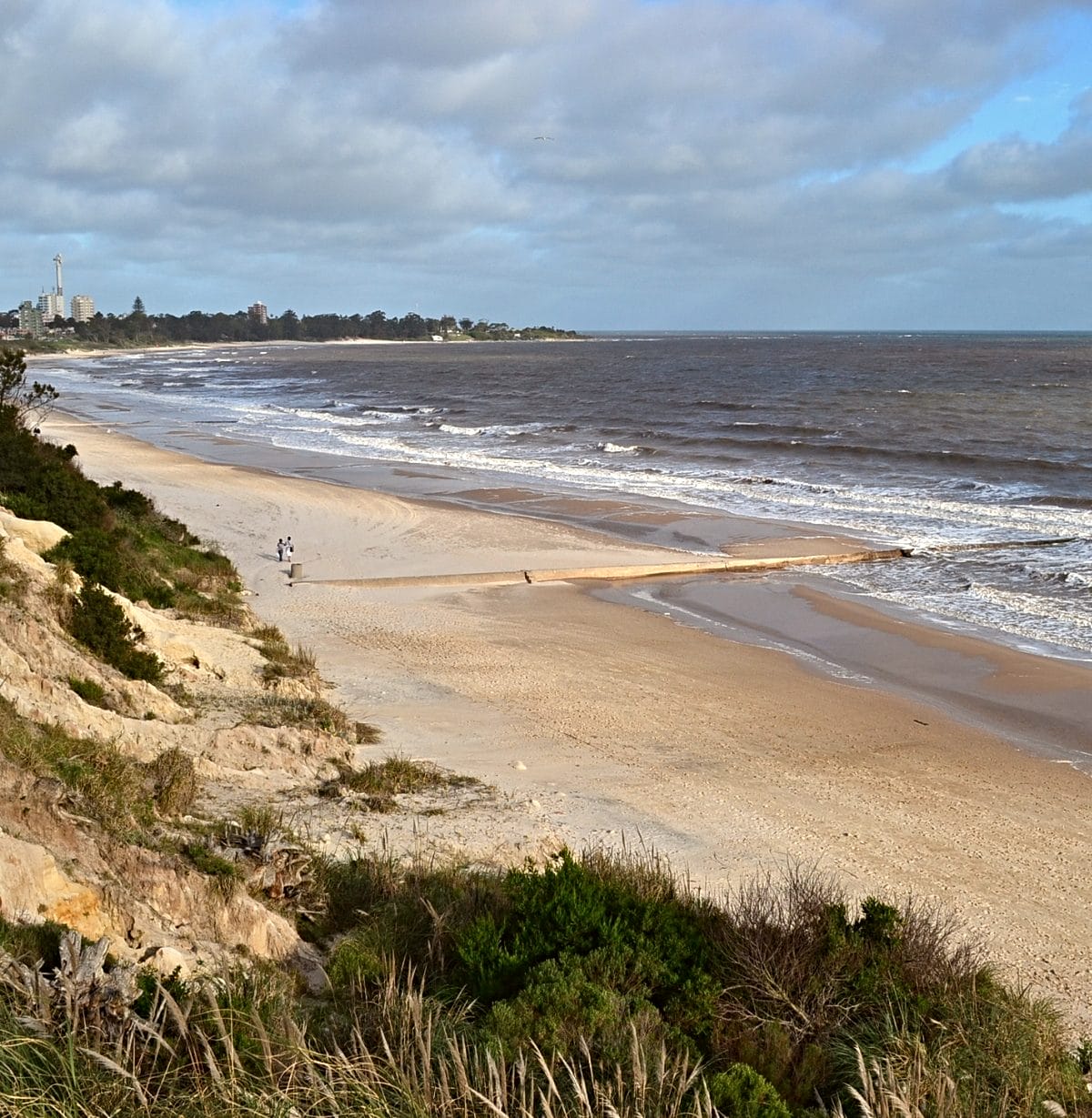 An expansive sandy beach in Atlantida, Uruguay